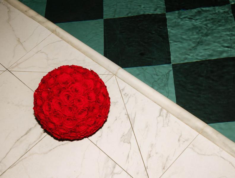 A bouquet or roses beside the pool