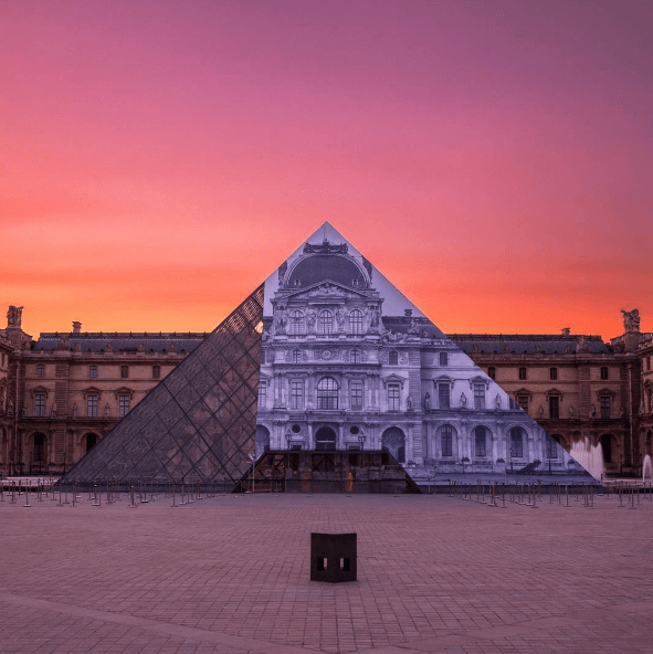 French artist JR’s latest installation, “Raising Questions”, at the Louvre in Paris. 