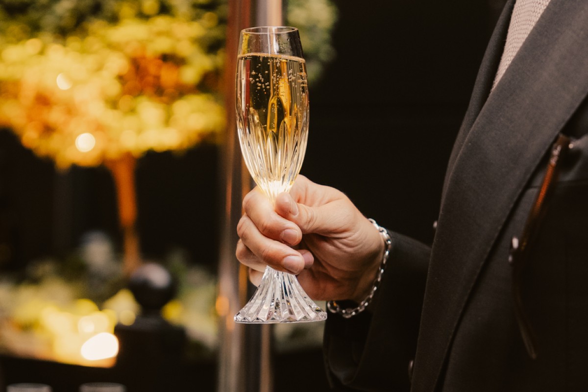 Man holding champagne glass