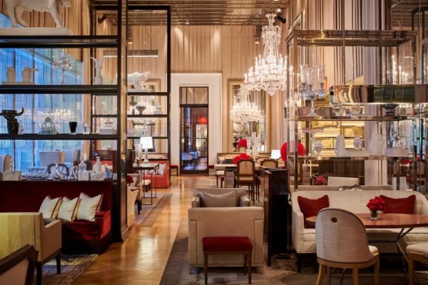 Inside The Baccarat Grand Salon with beautiful decor and plenty of sitting areas