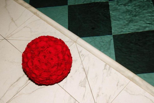 A bouquet or roses beside the pool