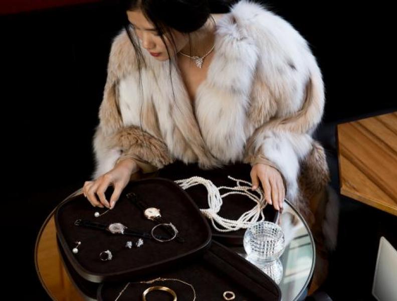 woman in fur coat shopping
