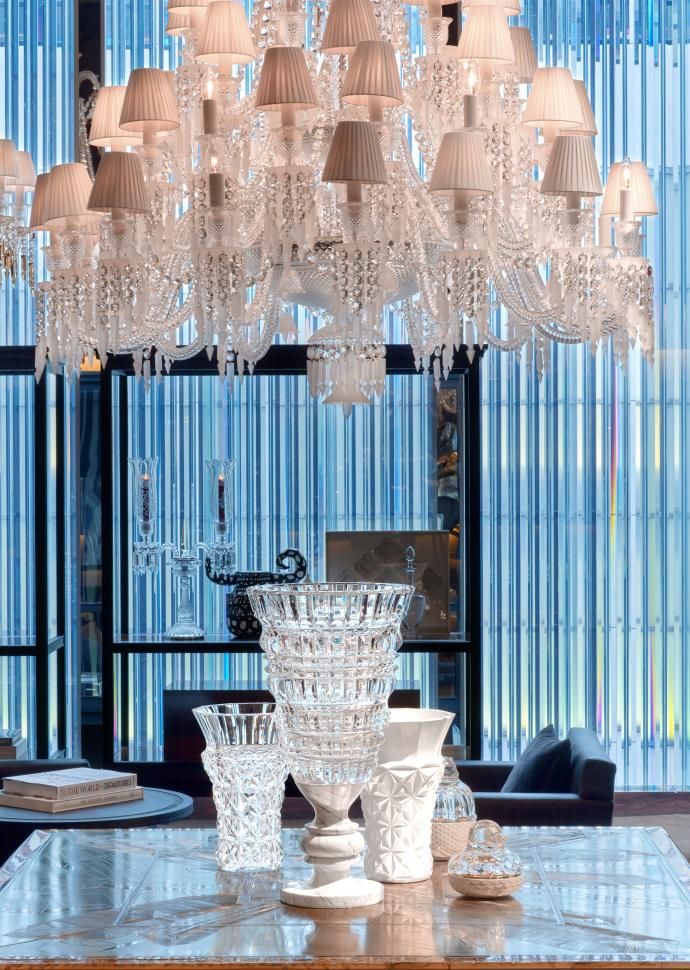 A crystal chandelier above a table at Baccarat hotel