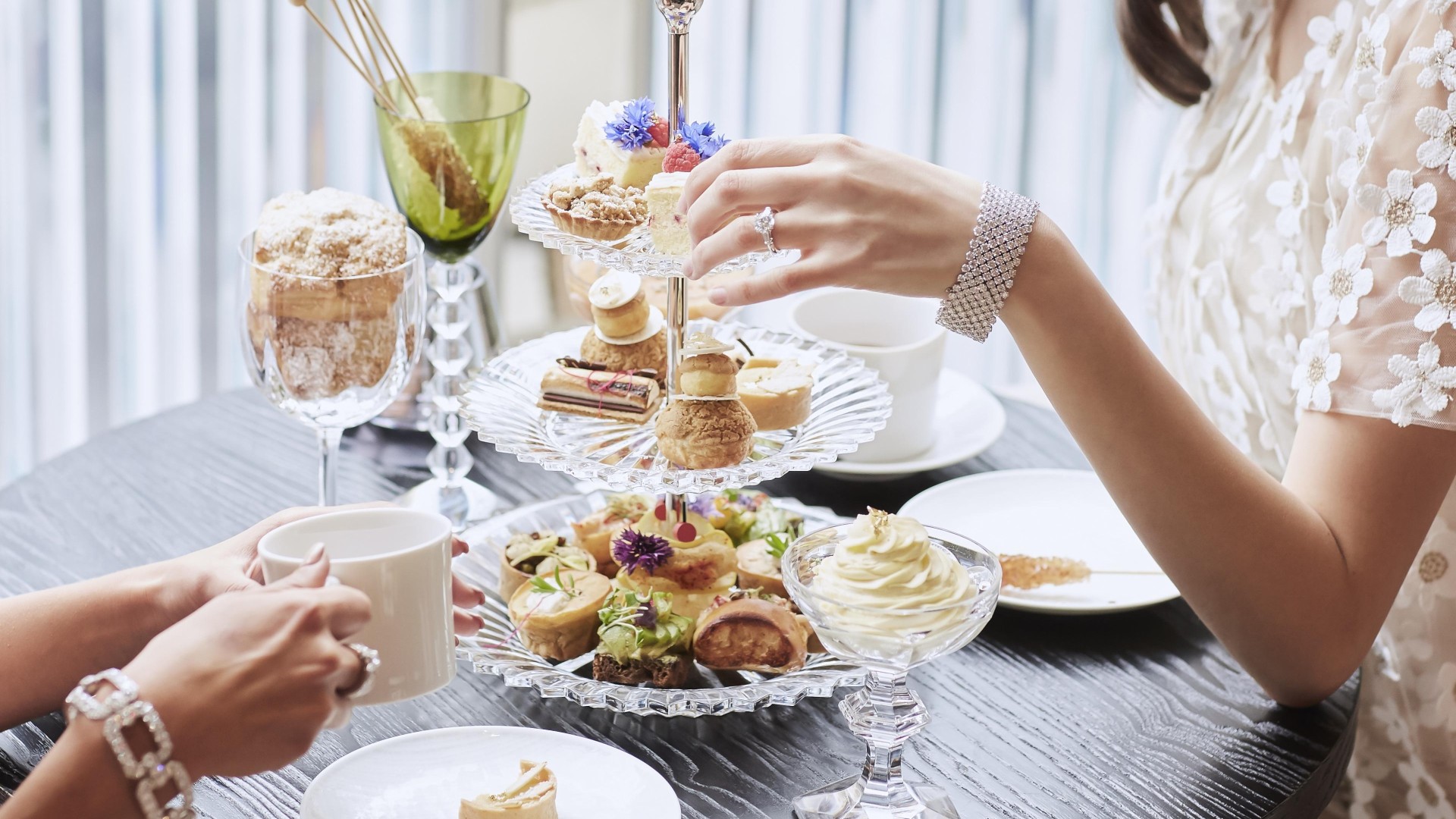 People eating an array of sweets