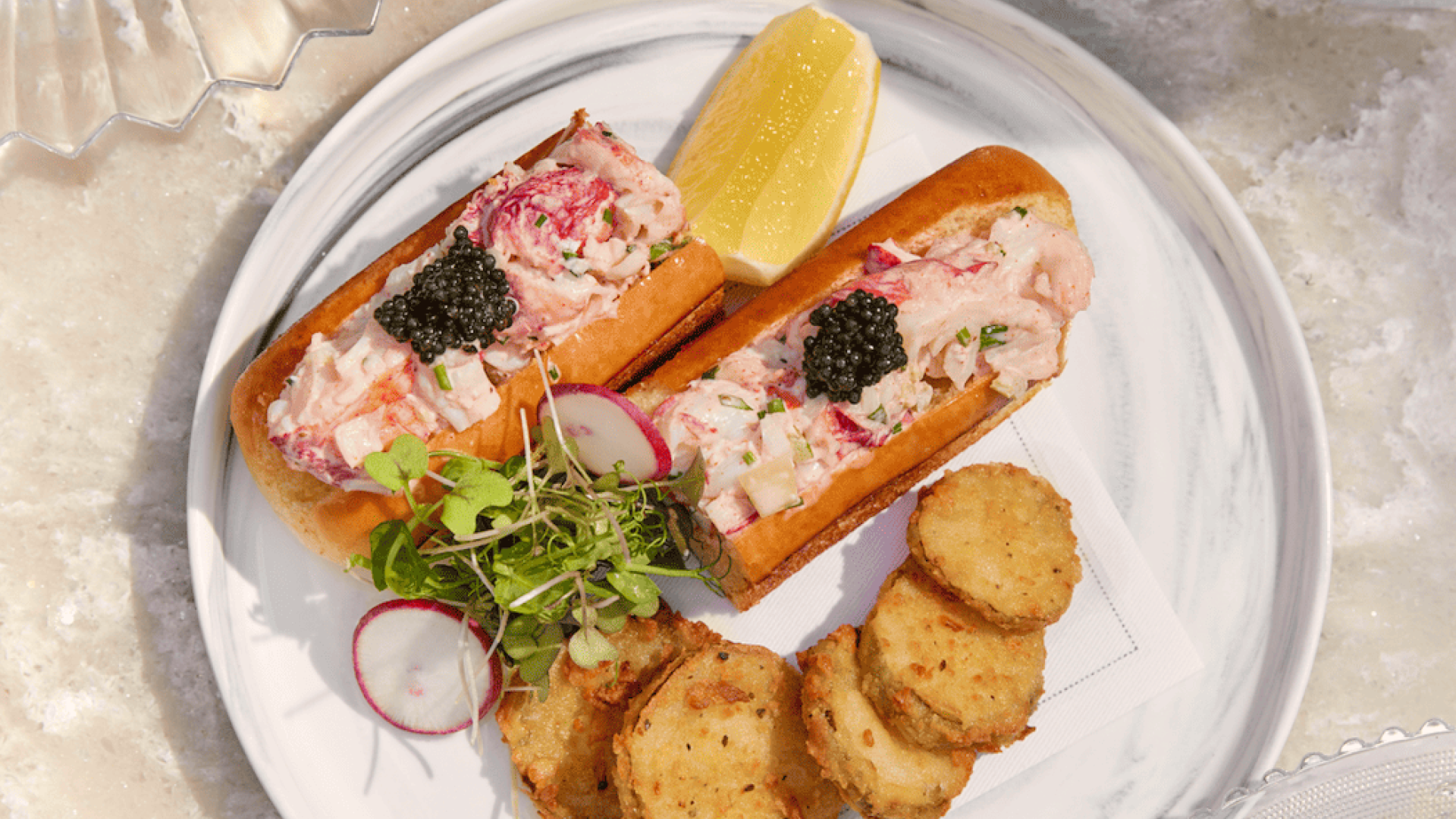 A lobster roll on a plate