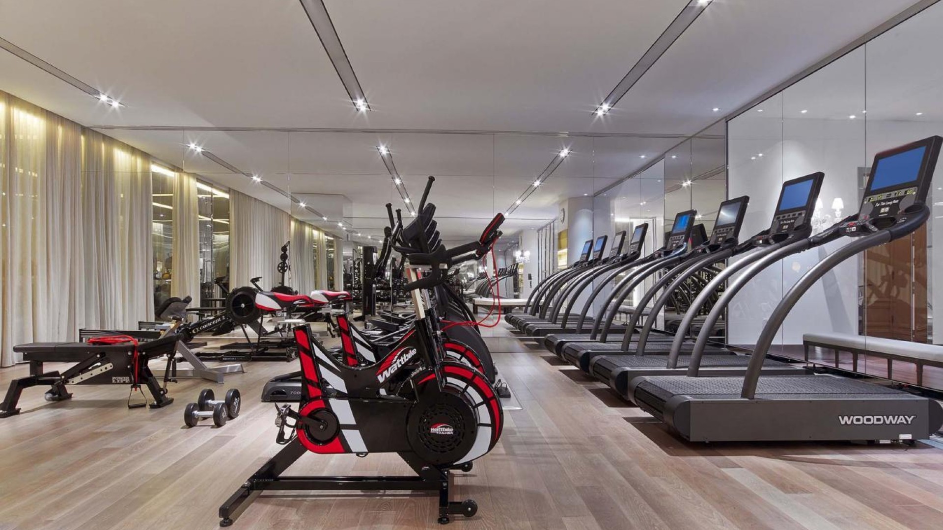 View of exercise bikes and treadmills