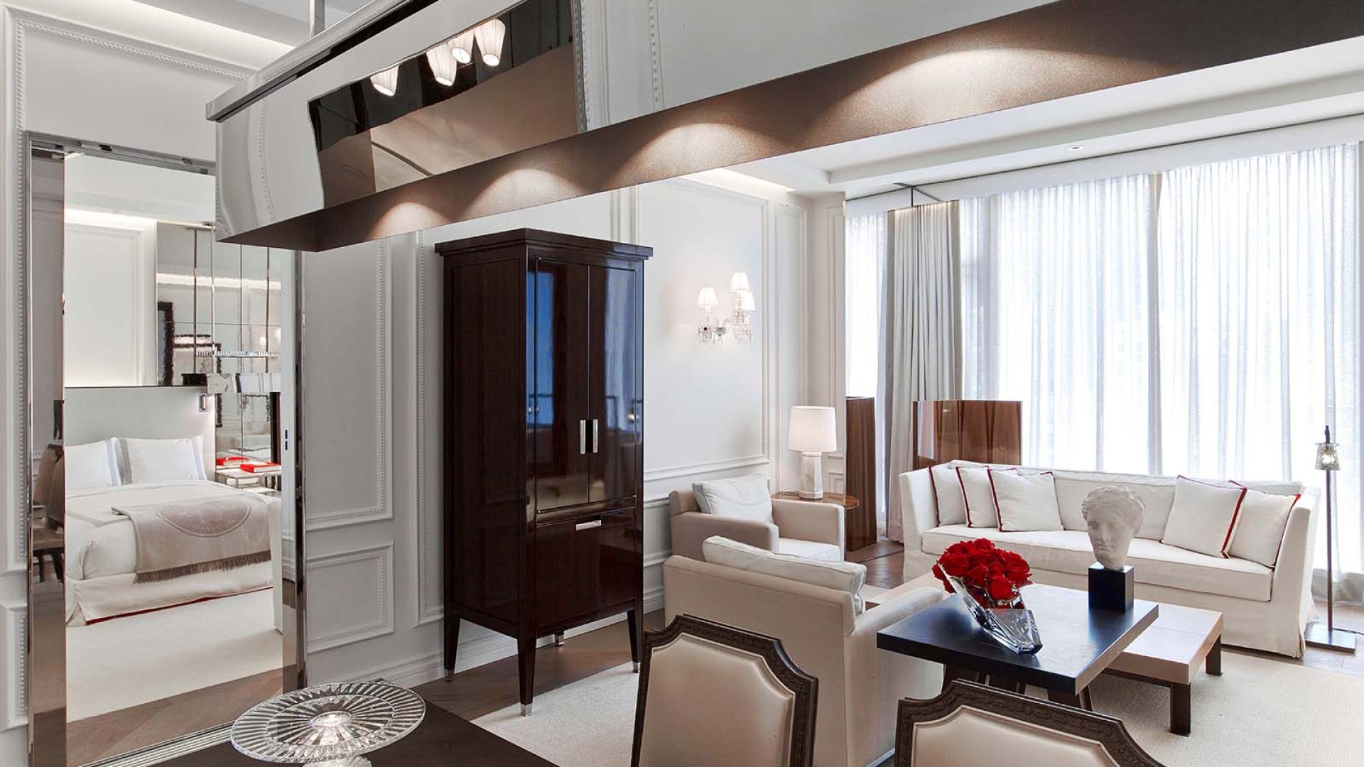 The dining table, living space and view of the room in the Harcourt One Bedroom Suite