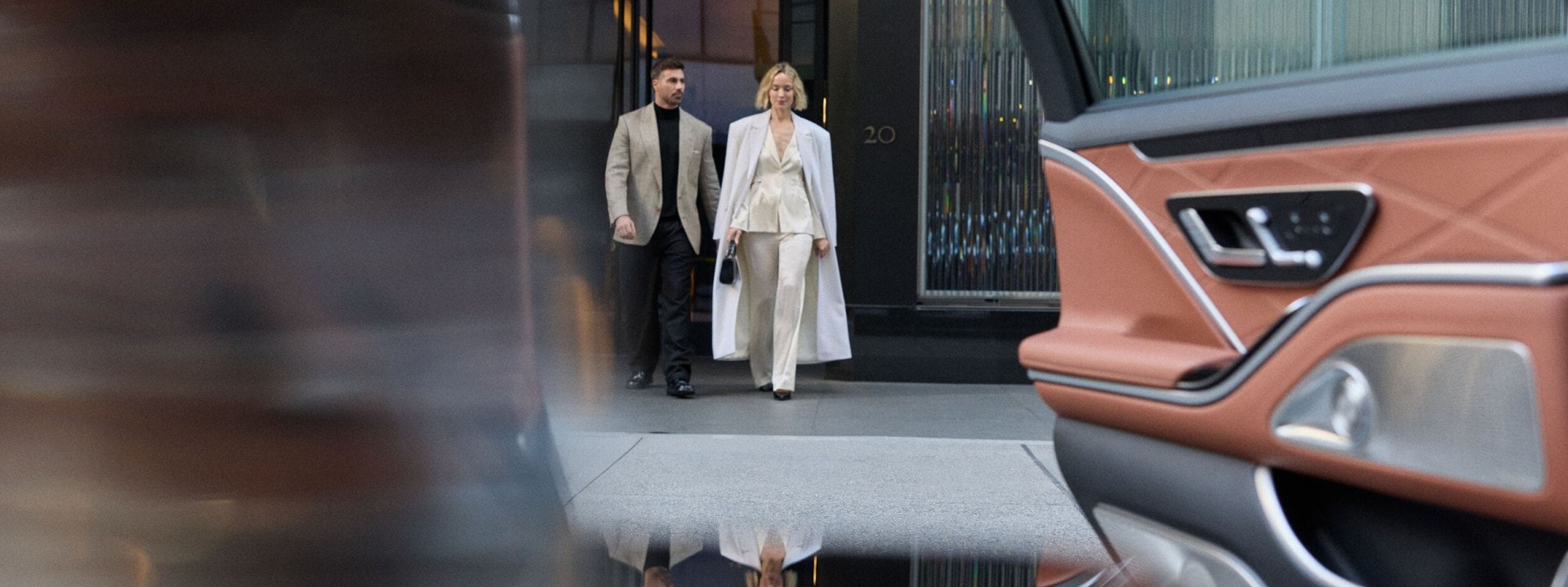 Well dressed couple walking from front door