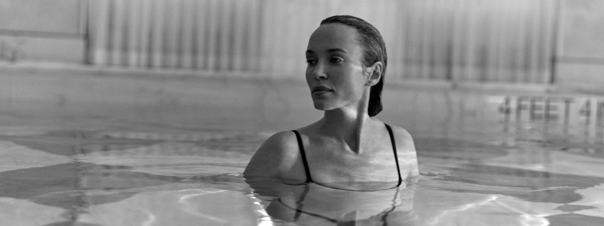 A woman relaxing in a pool 