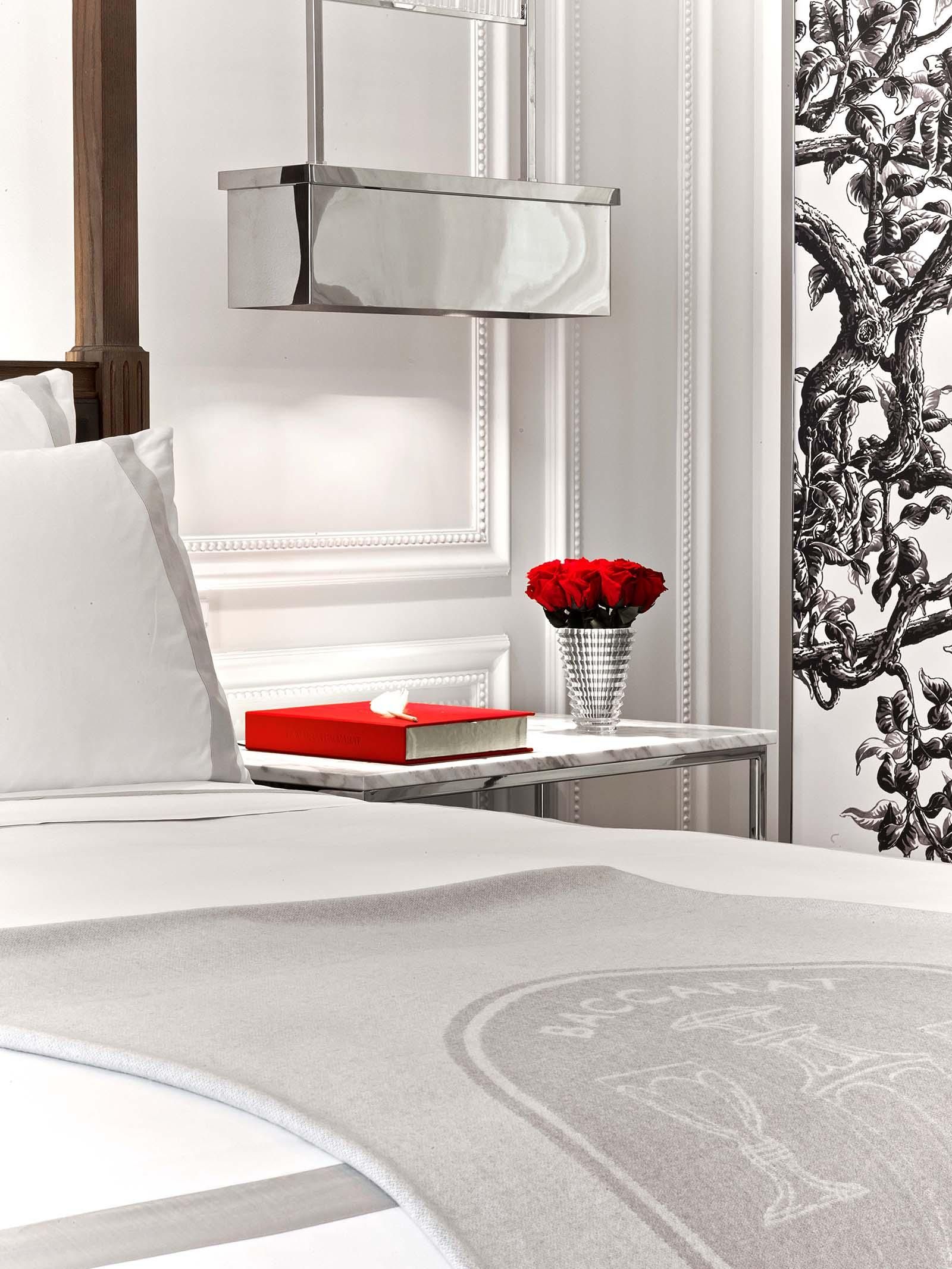 classic king room at the Baccarat hotel, red roses on side table