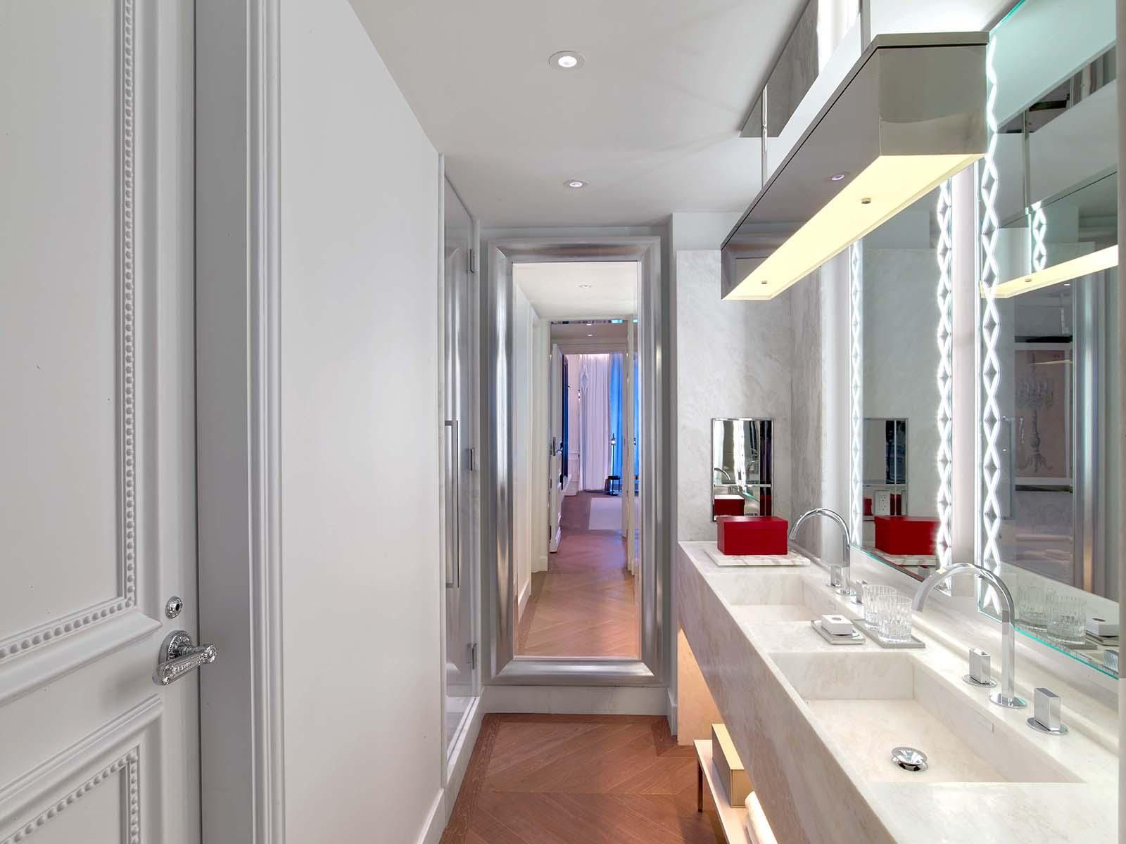 Prestige suite bathroom double sink white vanity at Baccarat hotel