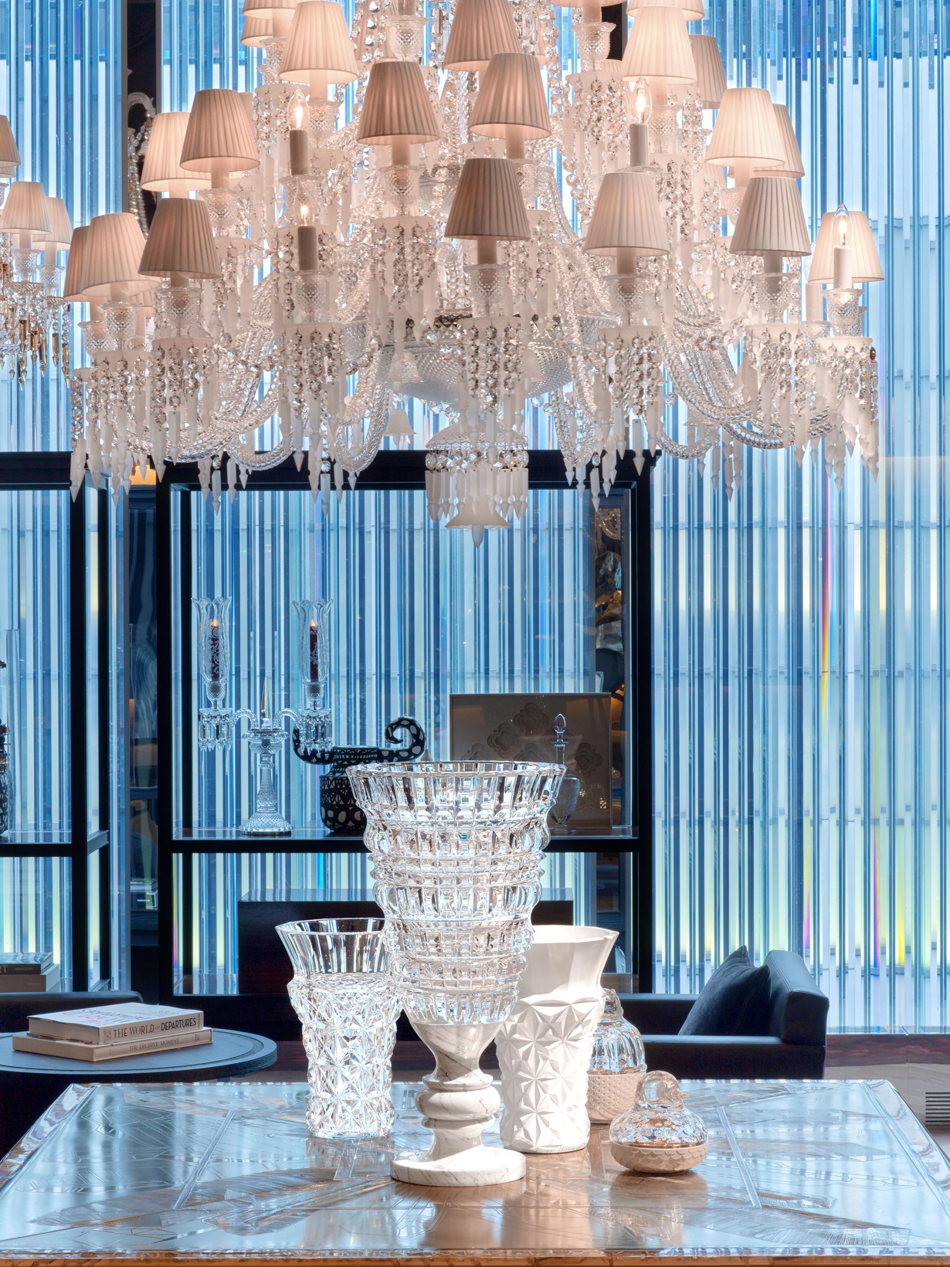 A crystal chandelier above a table at Baccarat hotel