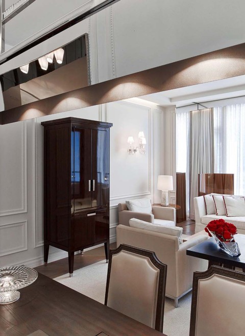 The dining table, living space and view of the room in the Harcourt One Bedroom Suite