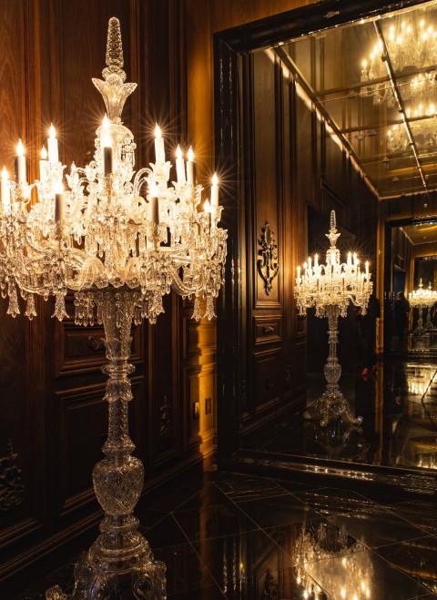 An elegant chandelier featuring multiple lights, casting a warm glow in the room