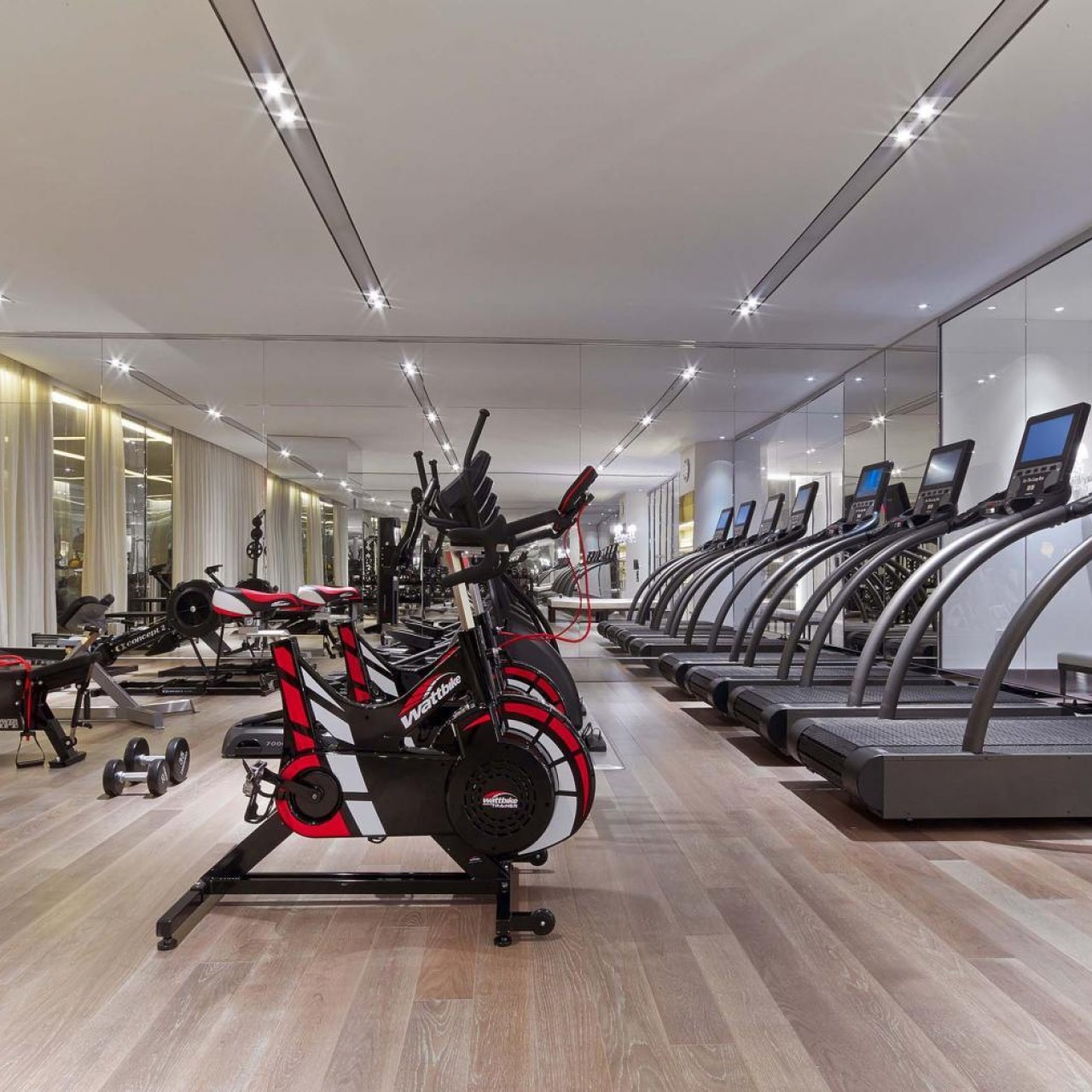 View of exercise bikes and treadmills