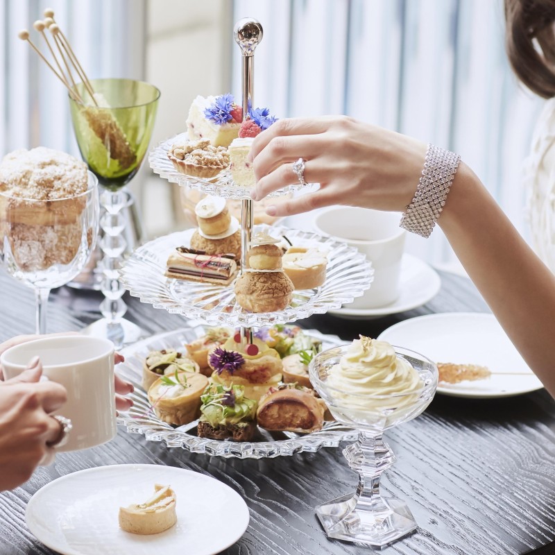 People eating an array of sweets