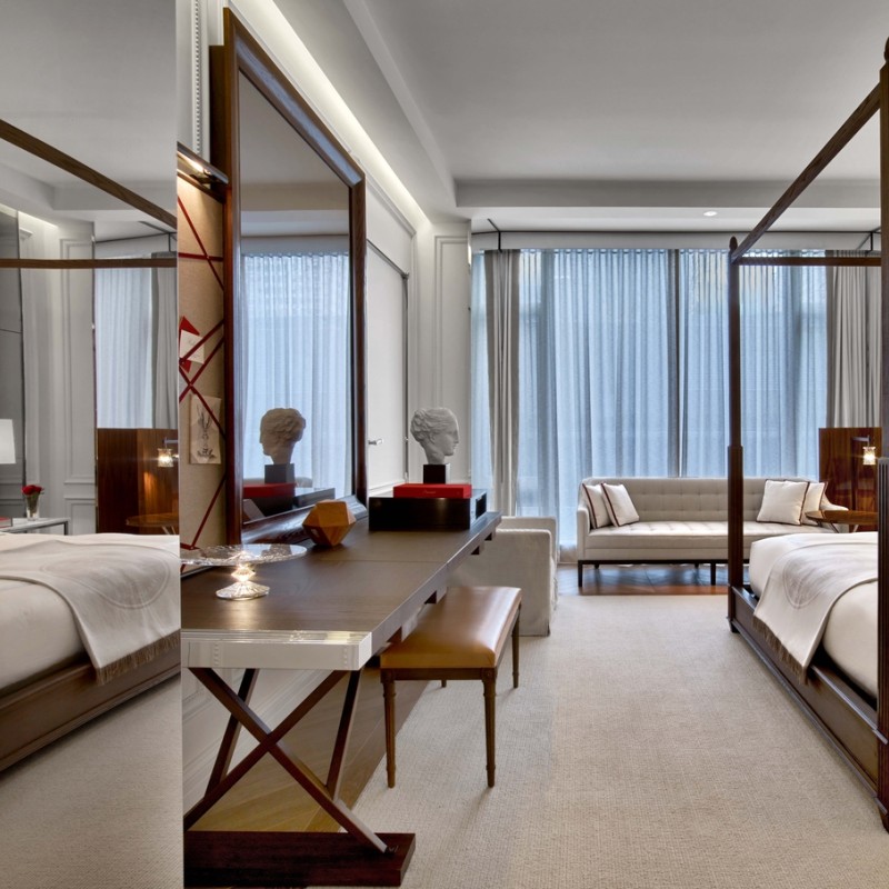 Desk, dining table, and king bed in a grand classic king