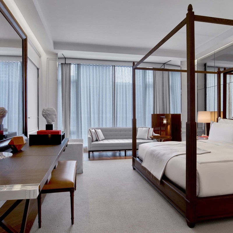 desk and king bed in a grand classic king room at Baccarat