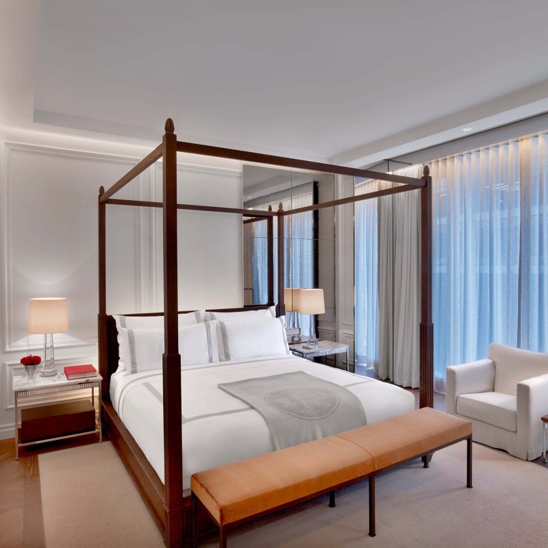 King bed with canopy in a Prestige Suite 