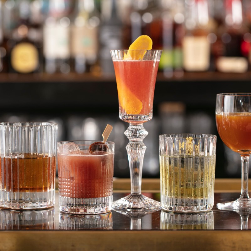 An assortment of cocktails on a bar top 