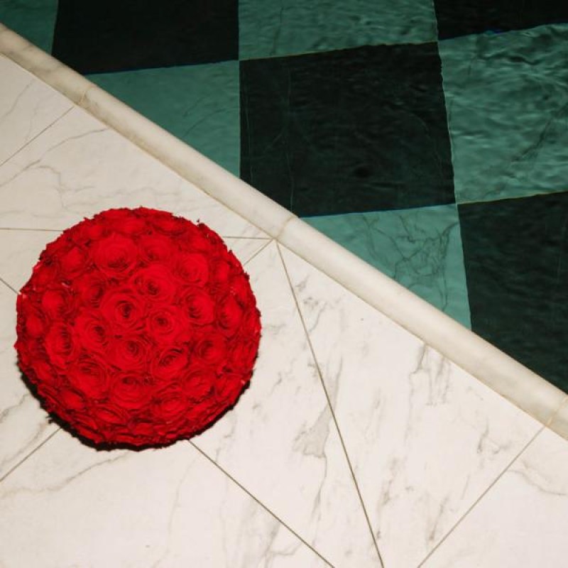 A bouquet or roses beside the pool
