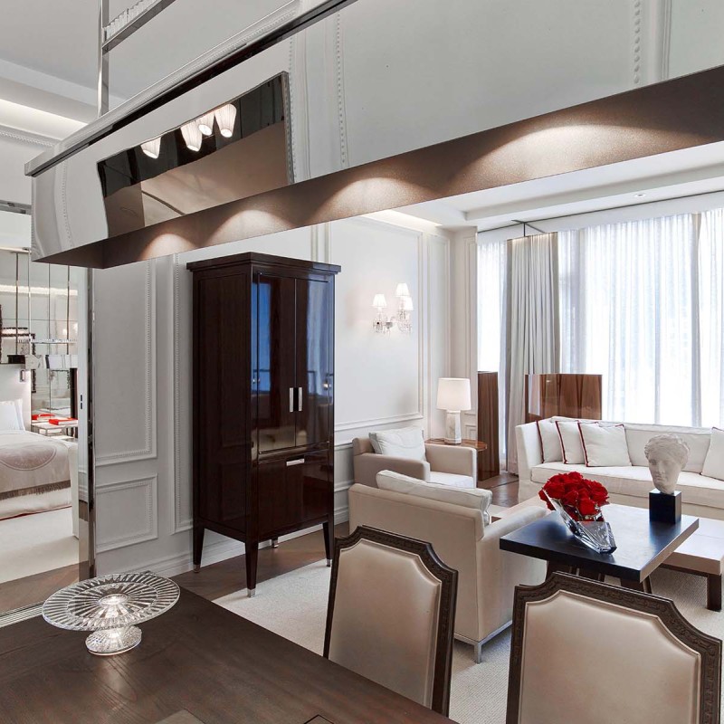 The dining table, living space and view of the room in the Harcourt One Bedroom Suite