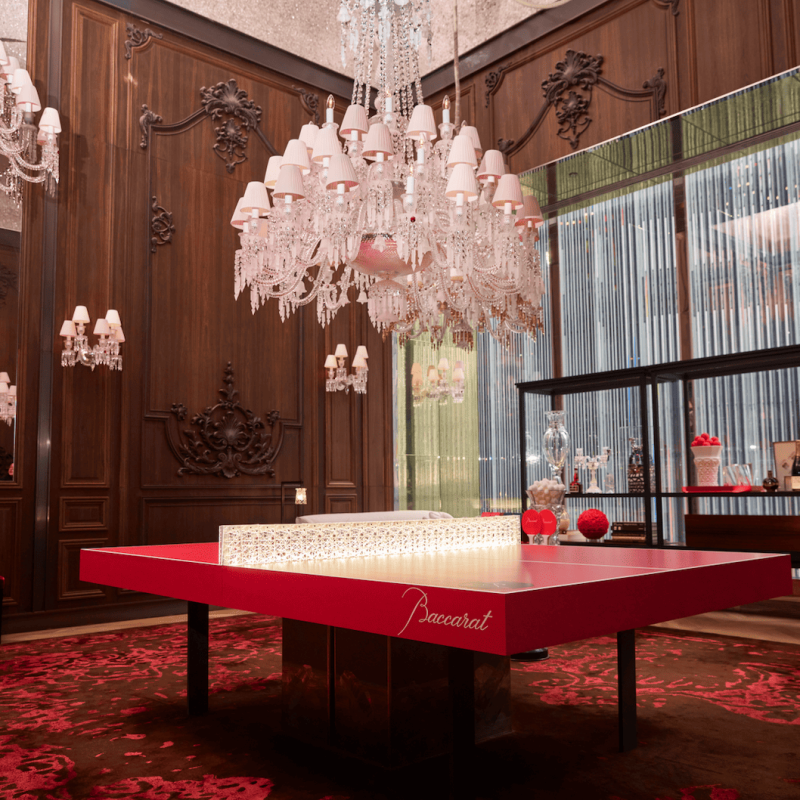 A chandelier above a table