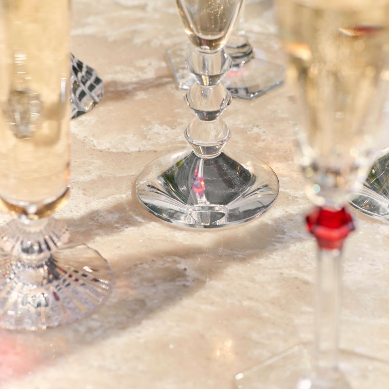 A table set with an array of elegant wine glasses, reflecting light and showcasing their crystal clarity